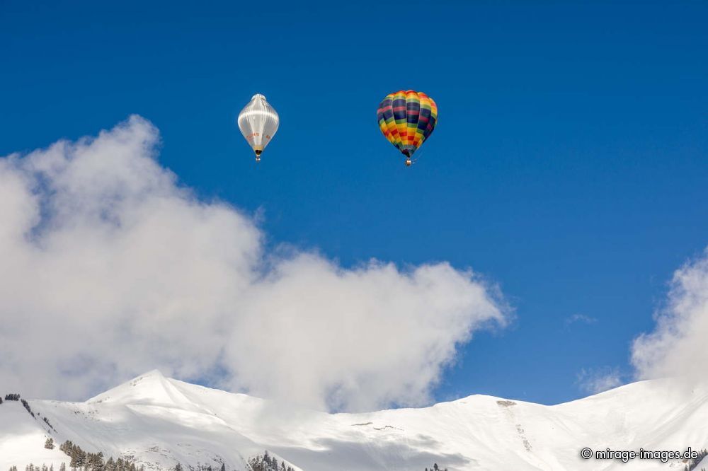 40th International Hot Air Balloon Festival - balloons are flying in the blue sky over the swiss mountain scenery
Chteau-dx
